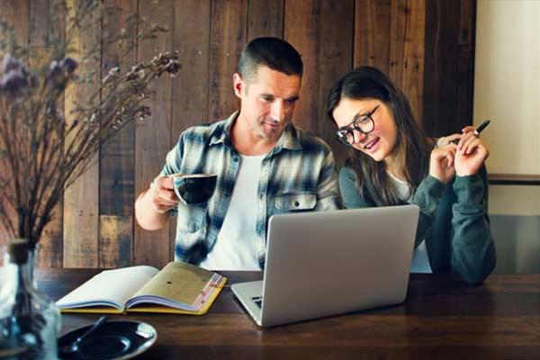 Couple Browsing For Homes